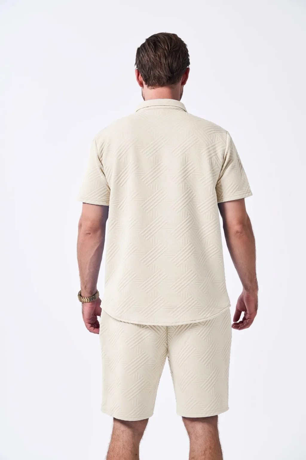A two-piece set of solid jacquard short-sleeved cardigan paired with casual drawstring shorts for the summer of 2025 6