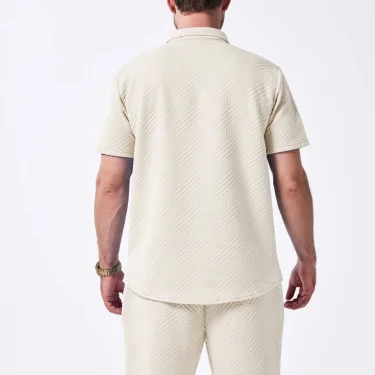 A two-piece set of solid jacquard short-sleeved cardigan paired with casual drawstring shorts for the summer of 2025 6