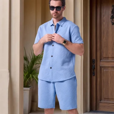 A two-piece set of solid jacquard short-sleeved cardigan paired with casual drawstring shorts for the summer of 2025 4